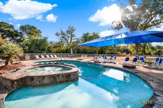 view of pool featuring a community hot tub and a patio