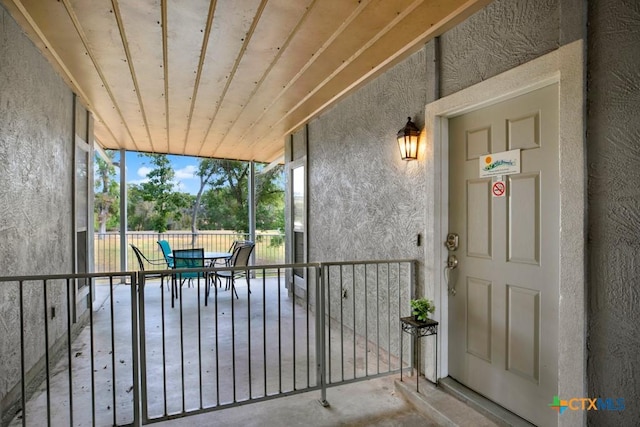 730 E Mather St Unit B101, New Braunfels, TX 78130 - property entrance with stucco siding and outdoor dining space