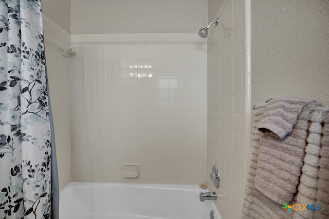 bathroom with shower / bath combo