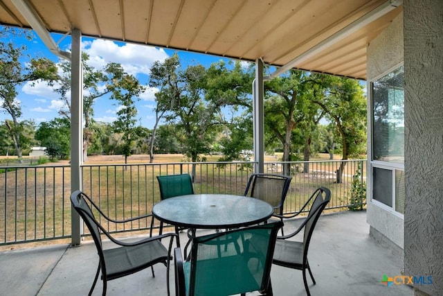 730 E Mather St Unit B101, New Braunfels, TX 78130 - view of patio / terrace with outdoor dining area and view of scattered trees