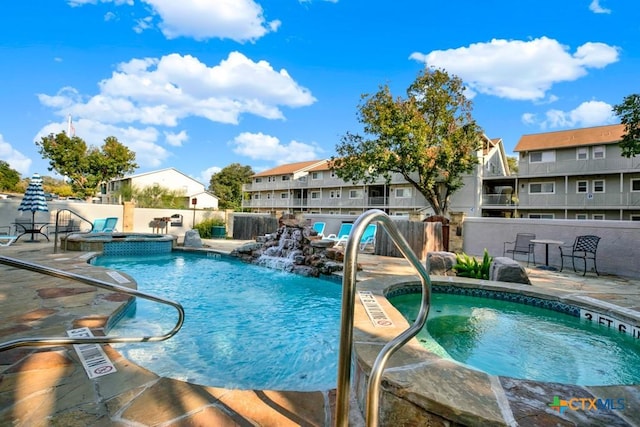 730 E Mather St Unit B101, New Braunfels, TX 78130 - view of swimming pool with a patio, a residential view, and a pool with connected hot tub