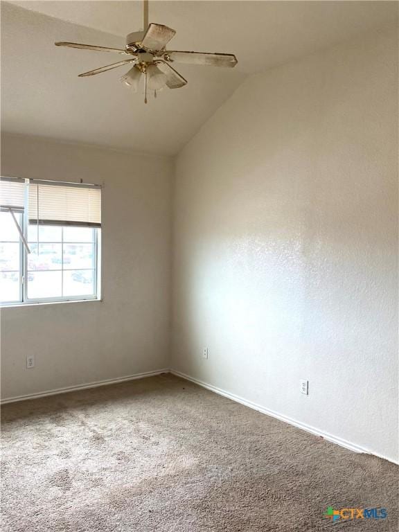 unfurnished room featuring carpet flooring, ceiling fan, and lofted ceiling