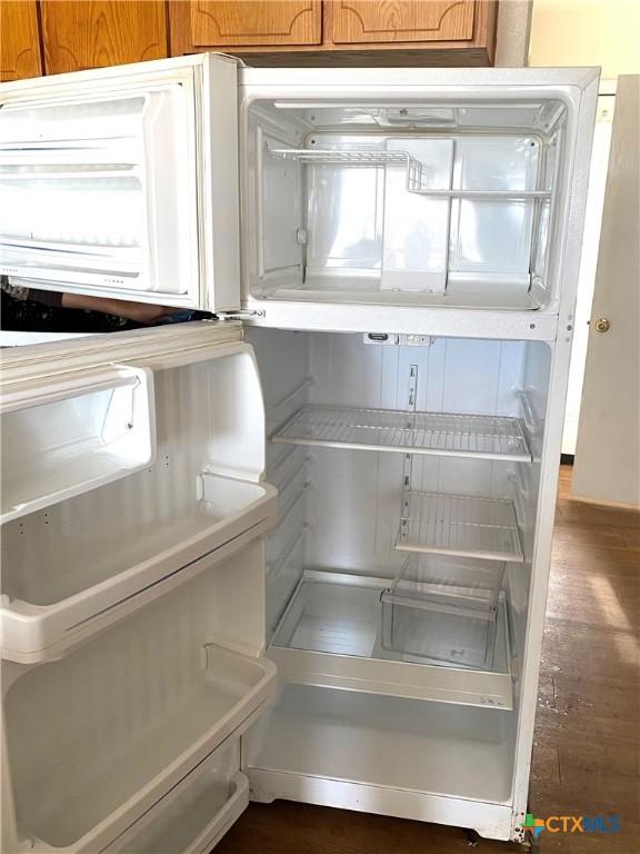 details with white fridge and dark hardwood / wood-style floors