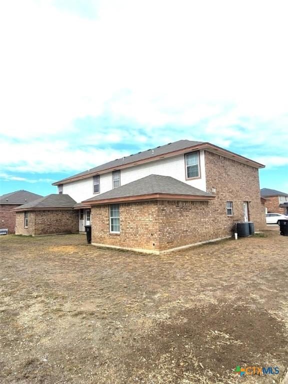 view of property exterior with central AC