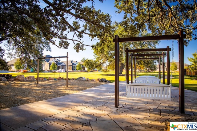 view of community with a playground and a yard