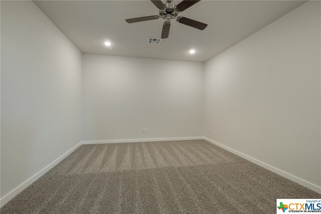 carpeted empty room featuring ceiling fan