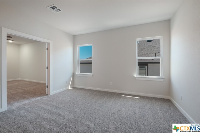 view of carpeted spare room