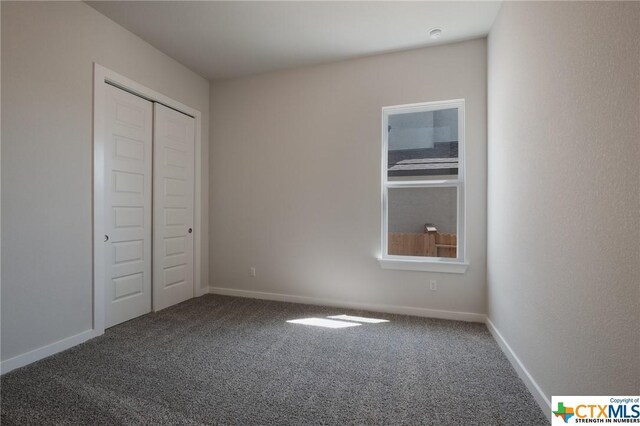 2240 Sur Ave, New Braunfels, TX 78132 - unfurnished bedroom with carpet, baseboards, and a closet