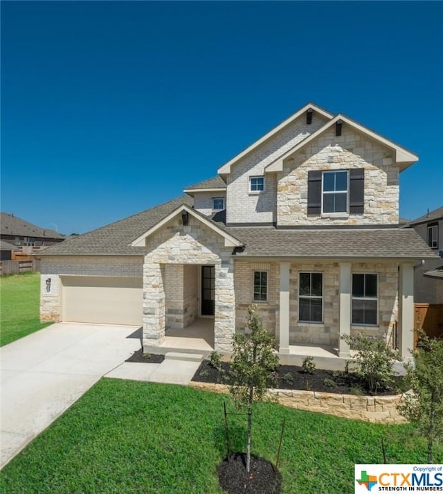 2240 Sur Ave, New Braunfels, TX 78132 - view of front of property featuring stone siding, an attached garage, a front lawn, and concrete driveway