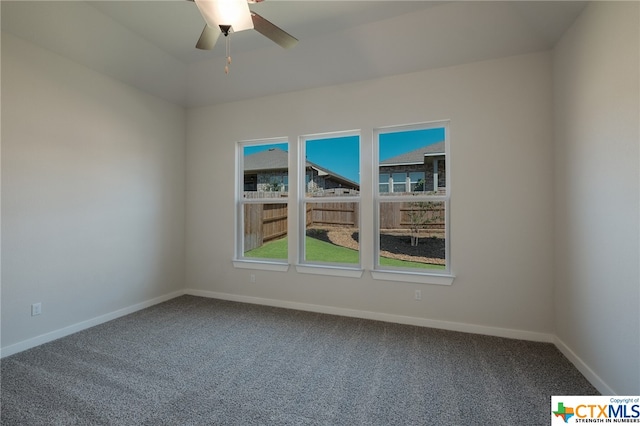 spare room featuring ceiling fan and carpet floors