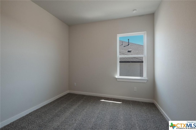 2240 Sur Ave, New Braunfels, TX 78132 - spare room featuring dark carpet and baseboards