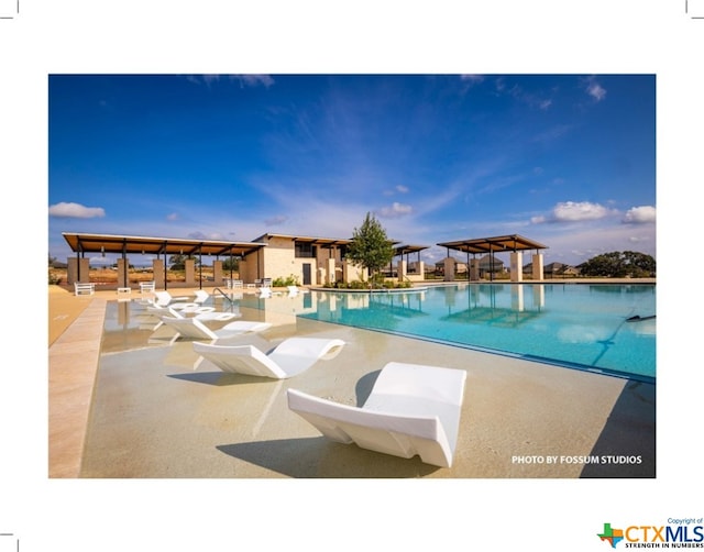 view of swimming pool featuring a gazebo and a patio area