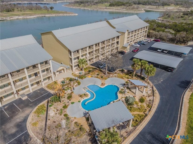 birds eye view of property with a water view