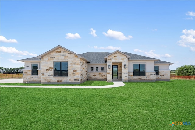 view of front of home with a front lawn