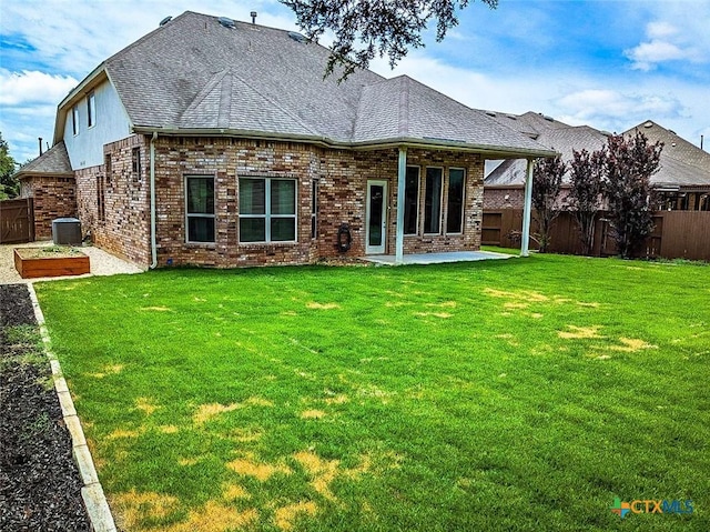 1226 Hidden Cave Dr, New Braunfels, TX 78132 - back of property with a patio area, a fenced backyard, brick siding, and roof with shingles