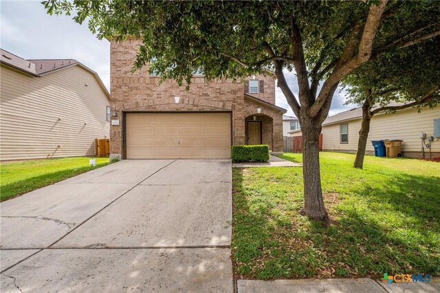 8913 Winter Haven Rd, Austin, TX 78747 - view of front of home with brick siding, driveway, a garage, and a front lawn