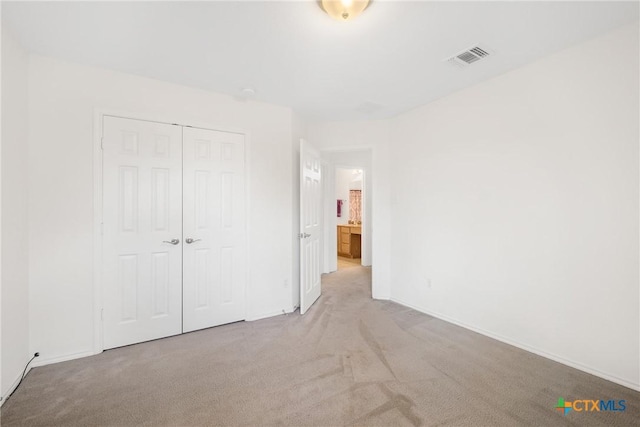 8913 Winter Haven Rd, Austin, TX 78747 - unfurnished bedroom featuring carpet, a closet, and baseboards