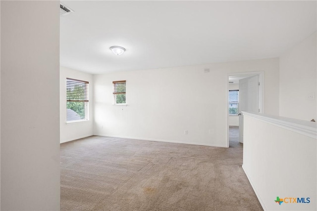 8913 Winter Haven Rd, Austin, TX 78747 - carpeted spare room with baseboards