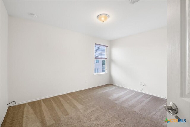 8913 Winter Haven Rd, Austin, TX 78747 - carpeted spare room featuring a smoke detector and baseboards