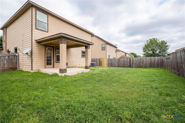 8913 Winter Haven Rd, Austin, TX 78747 - back of property with a patio and central air condition unit