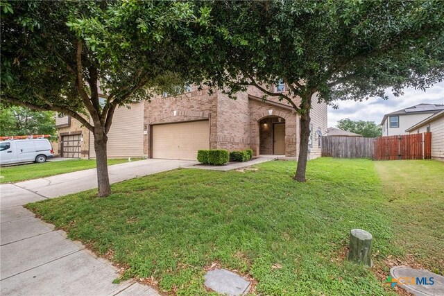 8913 Winter Haven Rd, Austin, TX 78747 - obstructed view of property with driveway, a garage, and brick siding