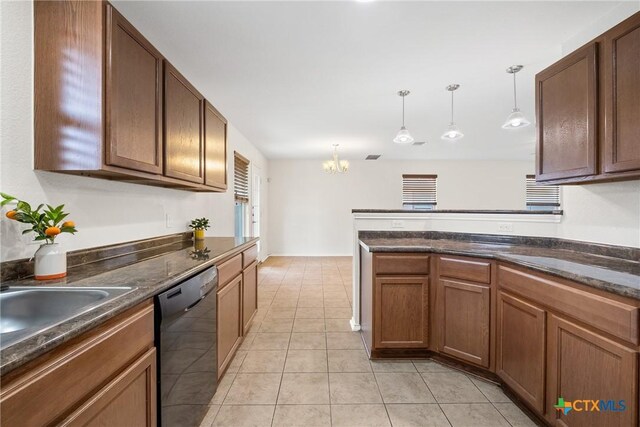 8913 Winter Haven Rd, Austin, TX 78747 - kitchen featuring dishwasher, a chandelier, dark countertops, and hanging light fixtures