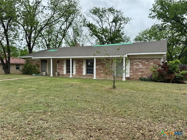 1804 Prather Dr, Killeen, TX 76541 - ranch-style home featuring a porch, brick siding, and a front lawn