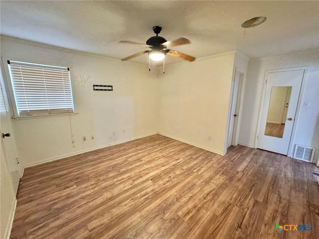 1804 Prather Dr, Killeen, TX 76541 - spare room featuring a ceiling fan, baseboards, visible vents, and wood finished floors