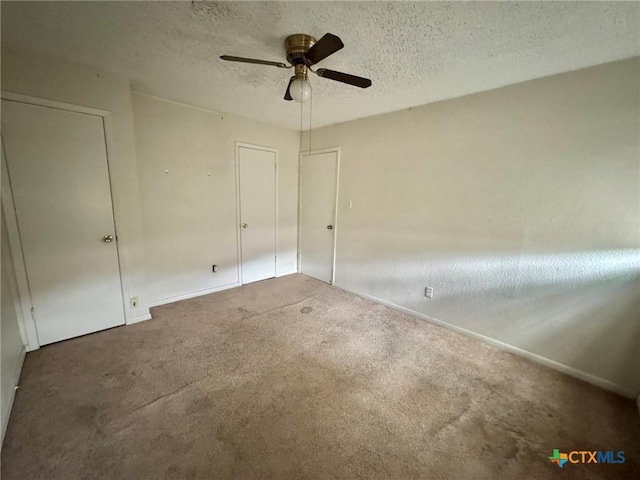 1804 Prather Dr, Killeen, TX 76541 - unfurnished bedroom featuring a ceiling fan, a textured ceiling, baseboards, and carpet