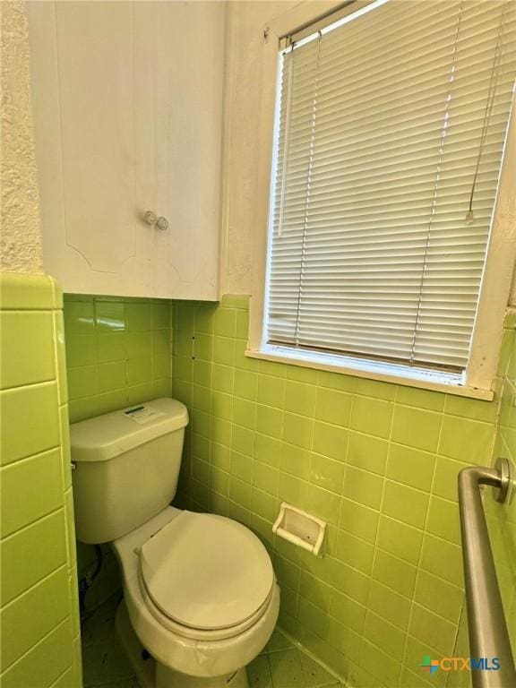 1804 Prather Dr, Killeen, TX 76541 - bathroom with toilet, tile walls, and wainscoting
