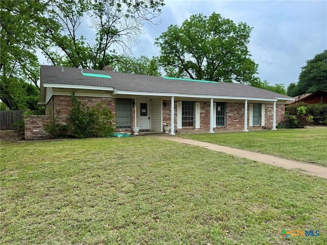 1804 Prather Dr, Killeen, TX 76541 - single story home with a porch, brick siding, fence, and a front lawn