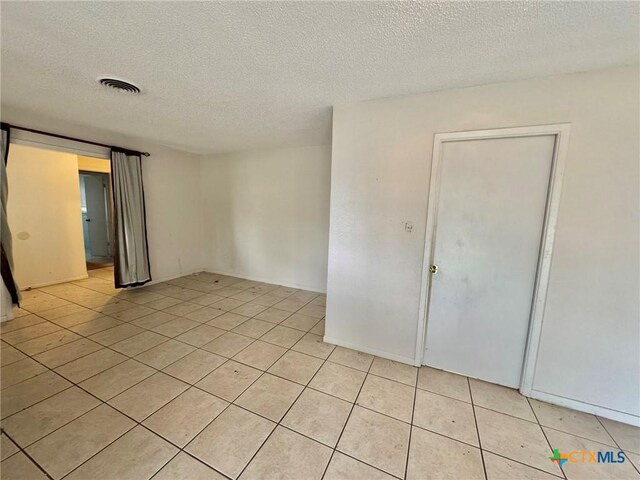 1804 Prather Dr, Killeen, TX 76541 - spare room with visible vents, a textured ceiling, and light tile patterned floors