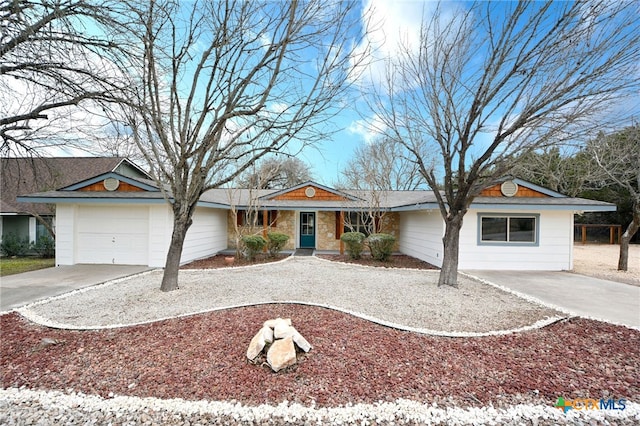 ranch-style house featuring a garage