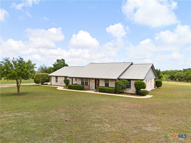 ranch-style house with a front lawn