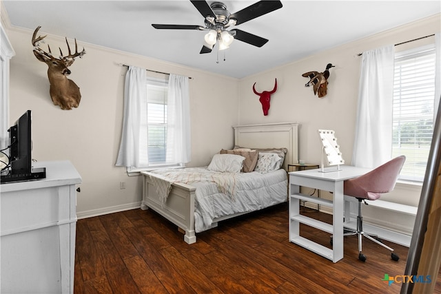 bedroom featuring ornamental molding, dark hardwood / wood-style flooring, and ceiling fan