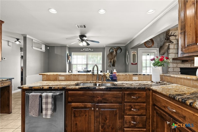 kitchen with dishwasher, plenty of natural light, ornamental molding, and sink