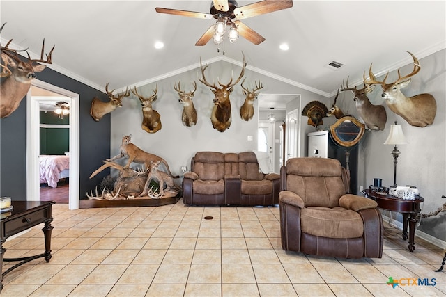 living room with ceiling fan, light tile patterned floors, vaulted ceiling, and ornamental molding