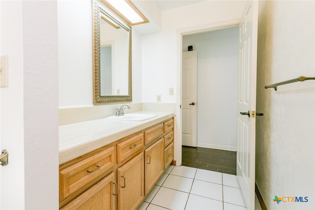 bathroom with vanity and tile patterned floors