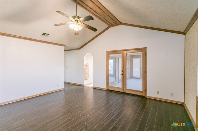 empty room featuring french doors, lofted ceiling, a textured ceiling, dark hardwood / wood-style floors, and ceiling fan