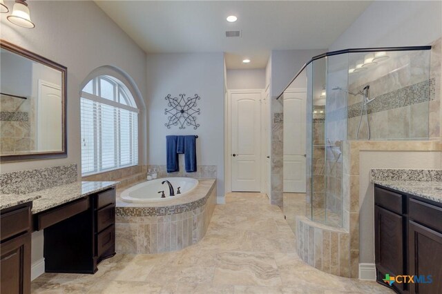 2326 Haven Bluff Ct, New Braunfels, TX 78132 - bathroom featuring vanity, a garden tub, a tile shower, and recessed lighting