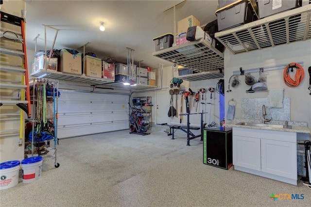 2326 Haven Bluff Ct, New Braunfels, TX 78132 - garage featuring a sink