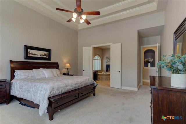 2326 Haven Bluff Ct, New Braunfels, TX 78132 - bedroom with light carpet, crown molding, baseboards, a towering ceiling, and connected bathroom