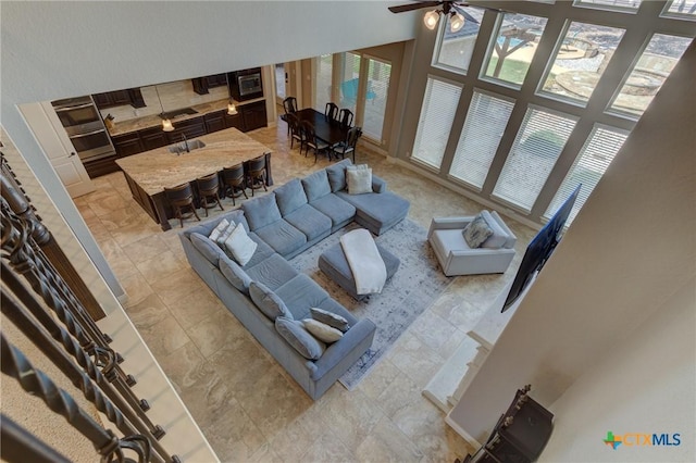 2326 Haven Bluff Ct, New Braunfels, TX 78132 - living room with a high ceiling and a ceiling fan