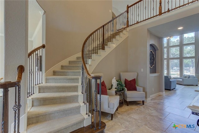 2326 Haven Bluff Ct, New Braunfels, TX 78132 - staircase with a towering ceiling and baseboards