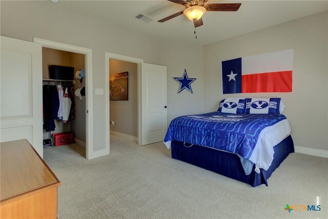 2326 Haven Bluff Ct, New Braunfels, TX 78132 - bedroom with carpet, baseboards, a spacious closet, ceiling fan, and a closet