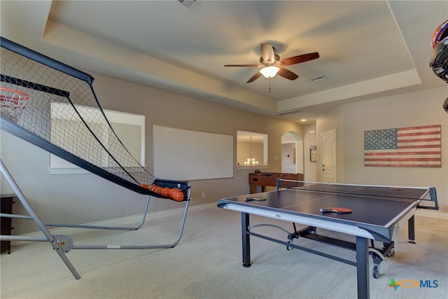 2326 Haven Bluff Ct, New Braunfels, TX 78132 - recreation room featuring carpet floors, baseboards, ceiling fan, arched walkways, and a tray ceiling