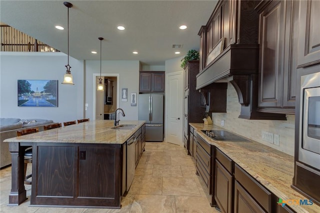 2326 Haven Bluff Ct, New Braunfels, TX 78132 - kitchen featuring a sink, stainless steel appliances, backsplash, a breakfast bar, and dark brown cabinetry