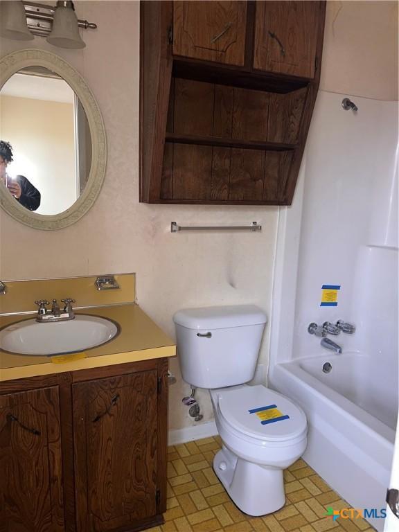 full bathroom with vanity, shower / bathing tub combination, and toilet