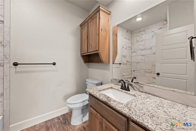 6119 Big Tree Dr, Salado, TX 76571 - full bath with baseboards, vanity, wood finished floors, toilet, and a shower