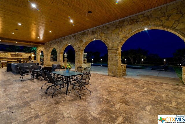 view of patio at twilight